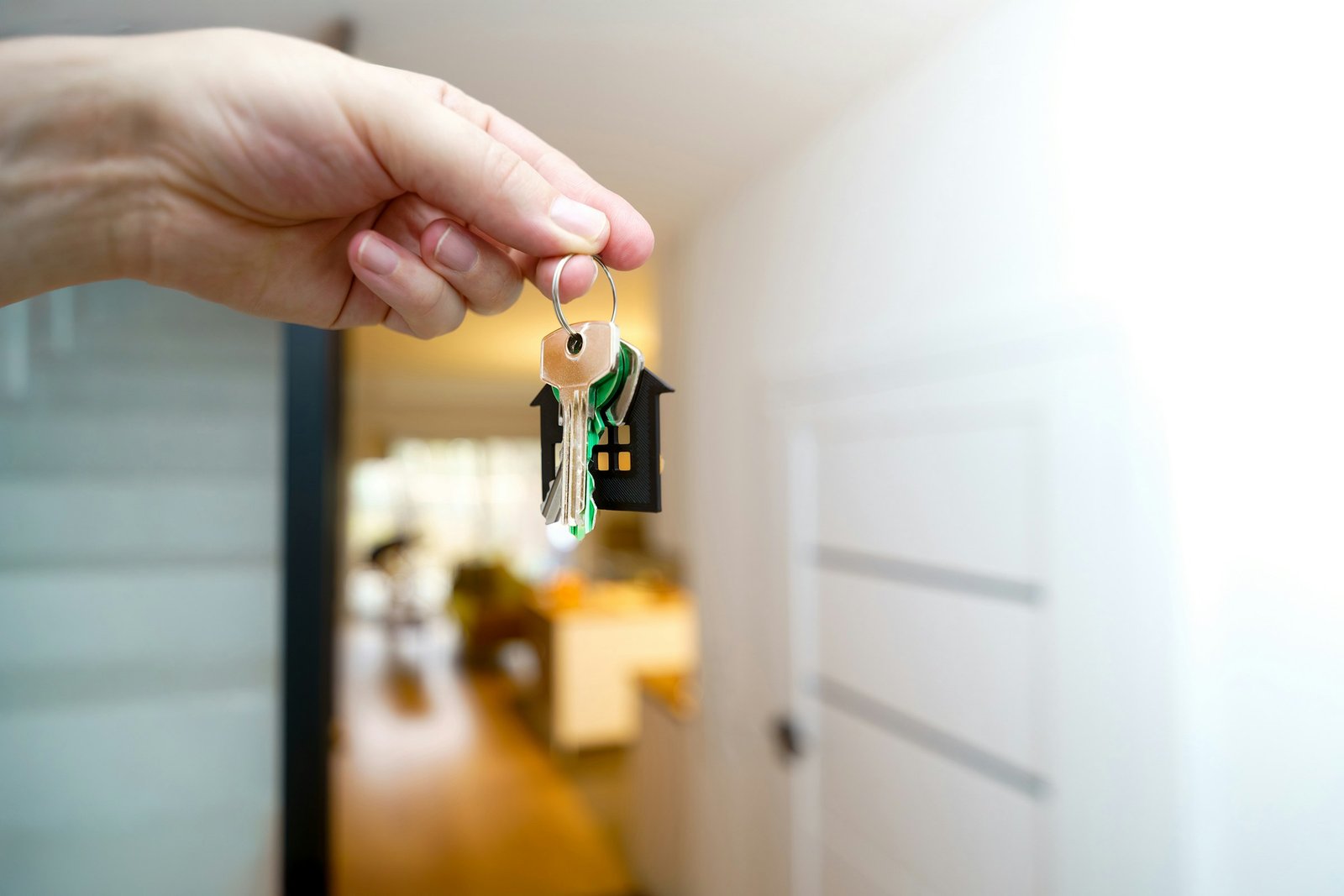 Hand holding house keys